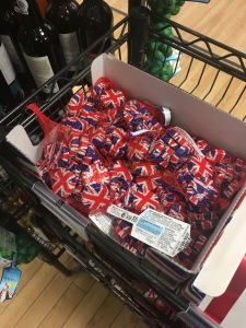 Marks and Spencer foiled Union Flag design solid milk chocolate discs. Made in the UK. On display at Marks and Spencer Luton Airport arrivals. Photograph by author.